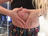 Busty blonde squeezes milk from stretchmarked tit