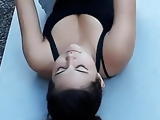 Doing crunches at yoga class 