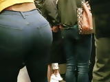 Candid big ass in jeans and a tiny top.