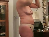 Mature wife drying hair 2