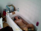 Aylie soaks her big tits and bush in the tub