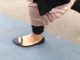 pakistani feet in black flat shoe
